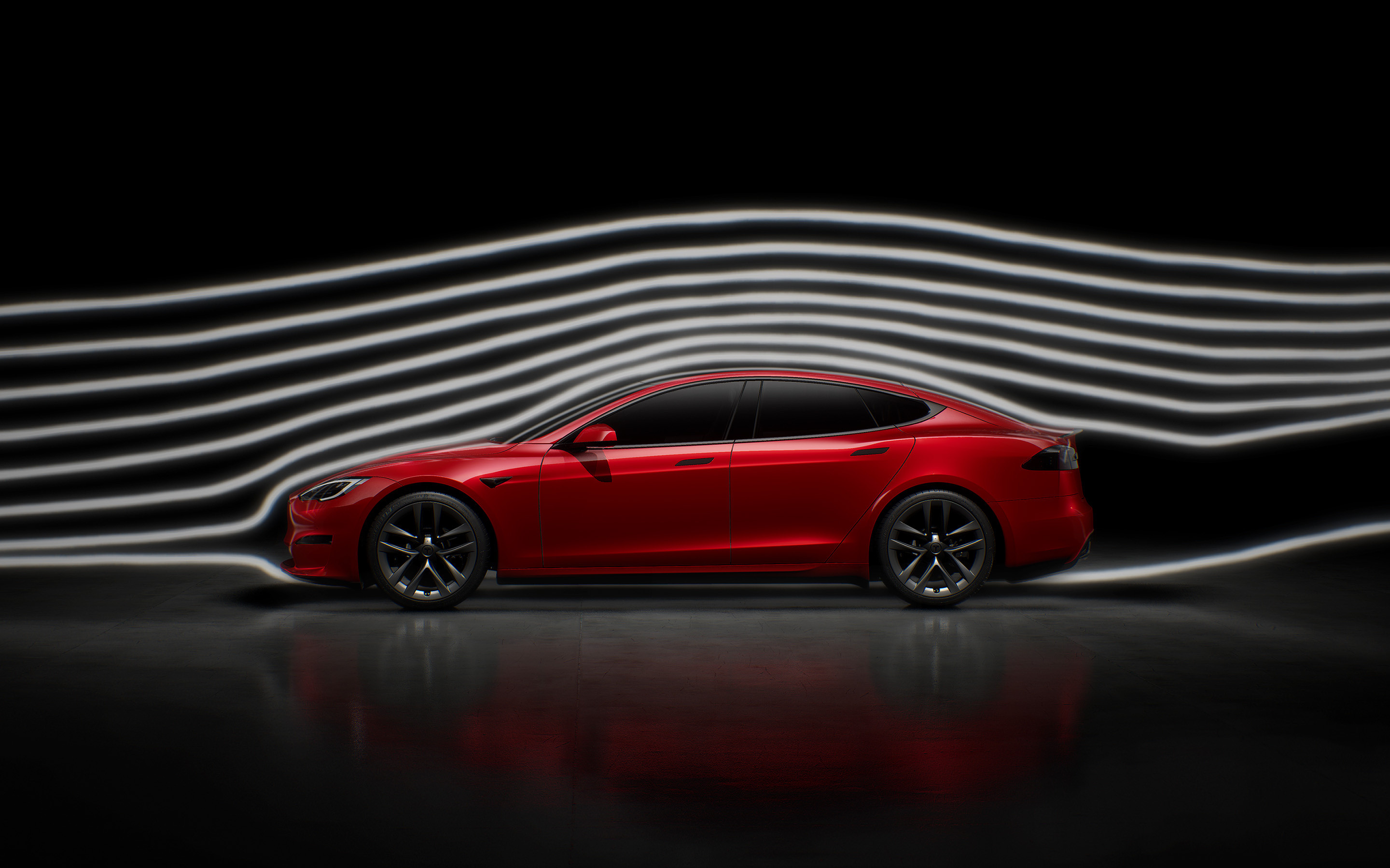 Rotes Tesla Model S auf einer Straße